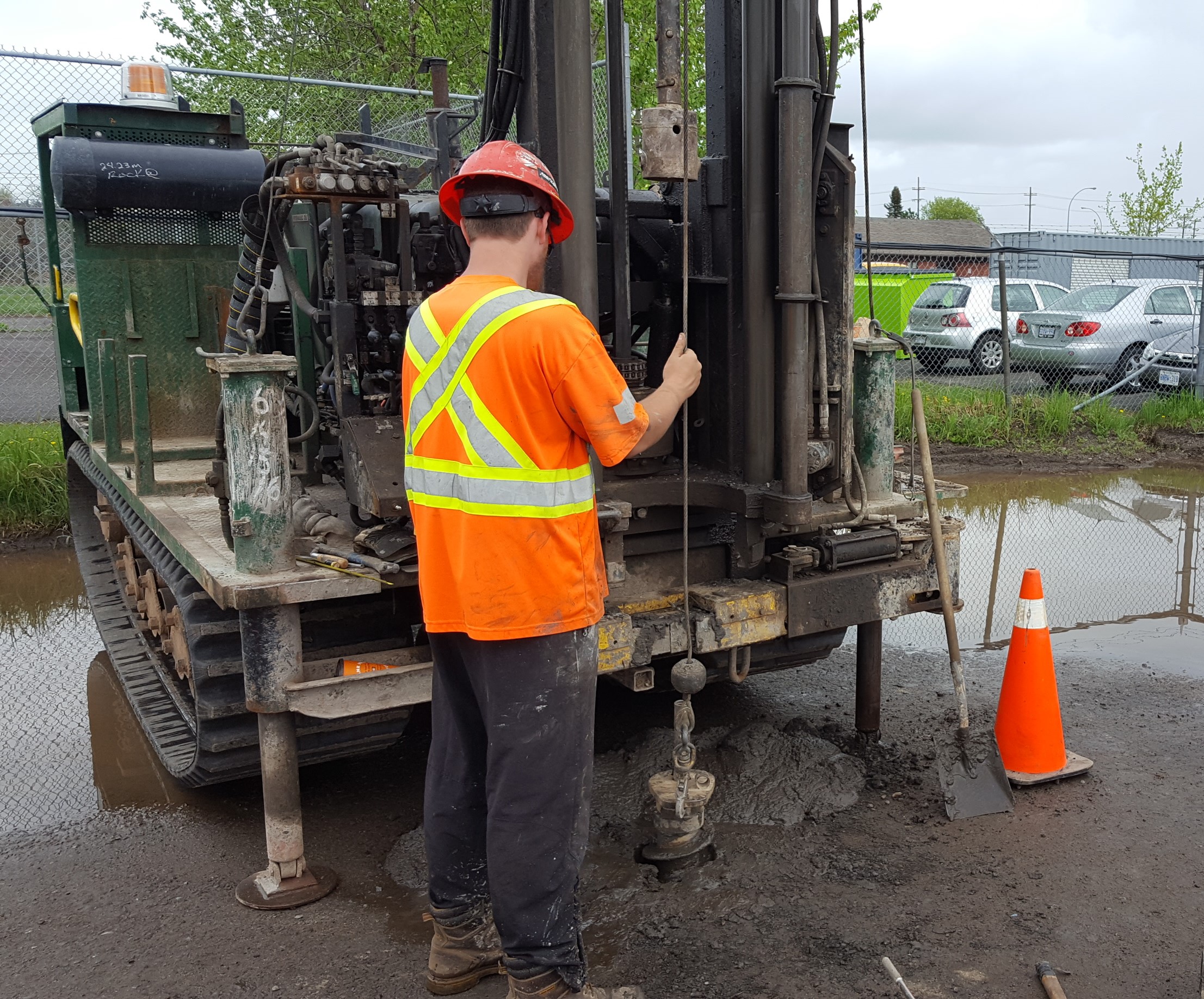 man using machine to dig hole